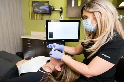 patient getting their teeth whitened at Edgewater Dental Arts